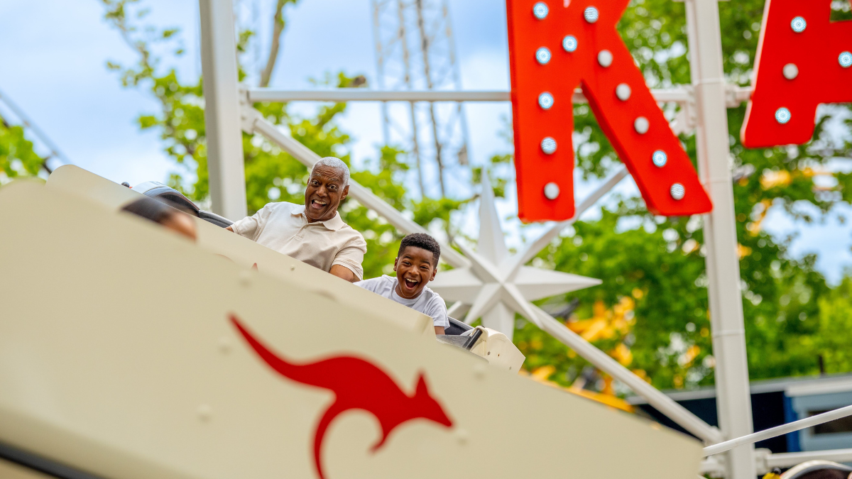 Grandfather and grandson enjoying a roller coaster ride at Kennywood Amusement Park